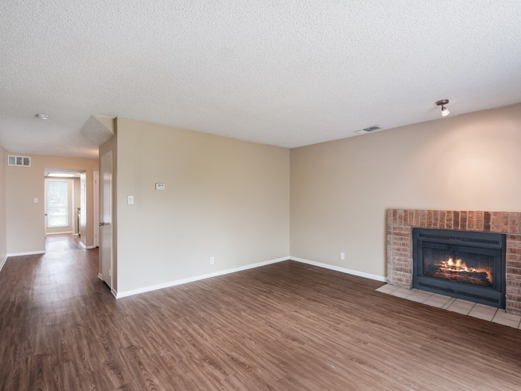 fireplace in living room with hardwood floors